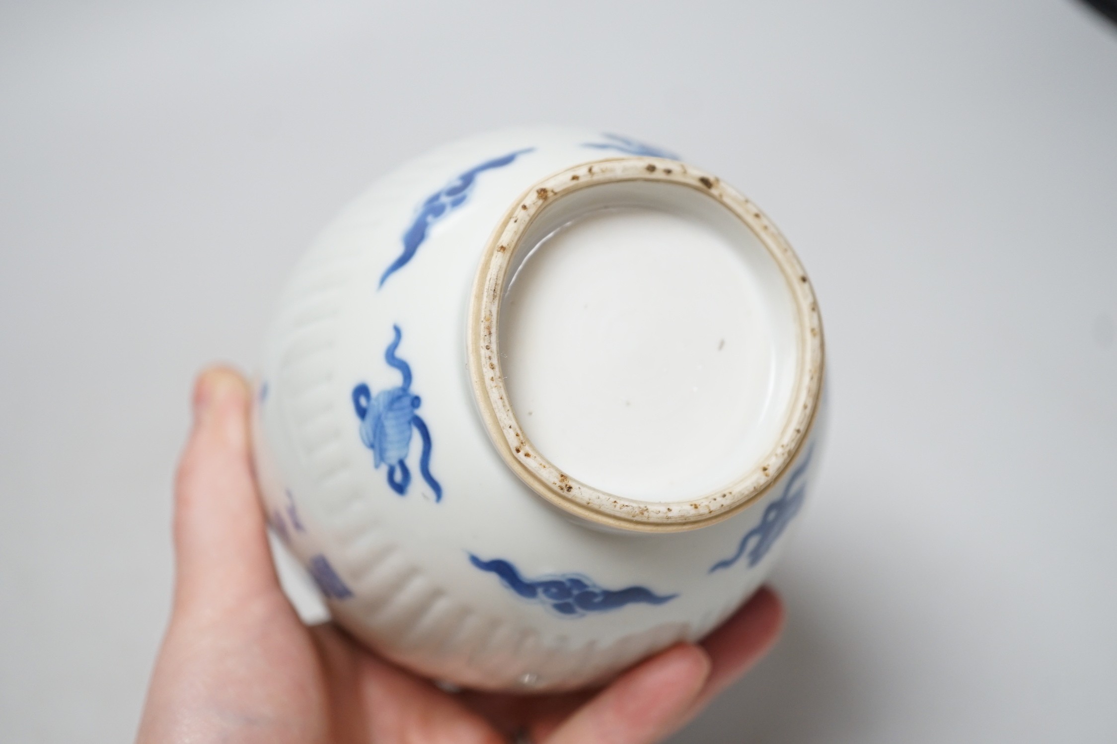 A Chinese blue and white fluted ovoid jar 16cm